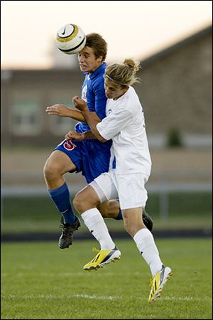 St. Francis de Sales senior Josh Albright, left, heads the ball in front of Northview’s Cole Gonia. St. Francis is 7-1-2.