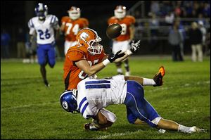 Anthony Wayne defensive back Josh Schwerer (11) forces Southview's Sterling Tyler to give up the ball as he tackles him during the Anthony Wayne-Southview game Friday night in Sylvania. The visiting Generals lost 28-7.
