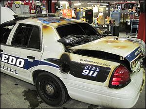 A Toledo police cruiser was destroyed when a safety flare in the trunk ignited. Police Sgt. Edward Mohr was responding to a call when the car caught fire. 