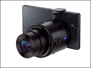 Sony's QX100 camera, which connects wirelessly to a cell phone, offers manual controls, optical image stabilization, a tripod mount, and a Zeiss f/1.8 lens.