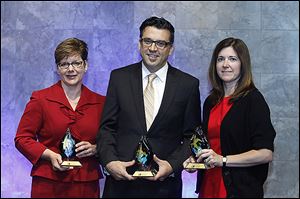 Awardees from left: Jan Ruma of Toledo/Lucas County CareNet, Marc Folk of The Arts Commission of Greater Toledo, and Kim Partin of the East Toledo Family Center, during the 2013 Innovation & Excellence Awards ceremony at The Premier in South Toledo.