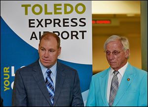  The Toledo-Lucas County Port Authority, led by Paul Toth, left, has rejected invitations to rejoin the Great Lakes Cruising Coalition. Board member Jerry Chabler, right, thinks his agency needs to promote Toledo as a nautical city.