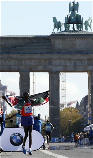 Wilson Kipsang from Kenya celebrates winning the 40th Berlin Marathon today in Berlin, Germany. Kipsang set a new world record of 2 hours, 3 minutes and 23 seconds.