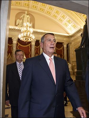 Speaker of the House John Boehner (R., Ohio) returns to his office after a vote over a measure that would prevent a possible shutdown of the federal government when it runs out of money. 