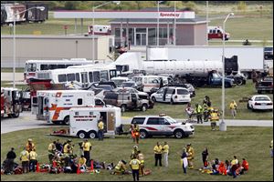 Authorities respond to cars in a simulation that included a 40-50 car pile-up caused by a tornado on the Ohio Turnpike between I-280 and I-75 during a Lucas & Northern Wood County Mass Casualty Incident Response Plan exercise at  Owens Community College.