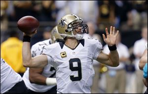 New Orleans Saints quarterback Drew Brees (9) passes in the first half.