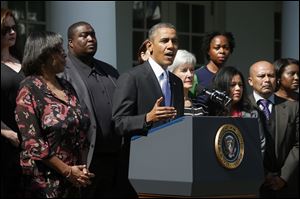 President Obama, accompanied by Health and Human Services Secretary Kathleen Sebelius, and people who support the Affordable Care Act, his signature health care law, speaks in the Rose Garden of the White House.