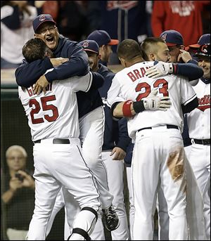 Cleveland Indians designated hitter Jason Giambi, left, picks up manager Terry Francona after Giambi hit a two-run home run off Chicago White Sox relief pitcher Addison Reed in the ninth inning Sept. 24.