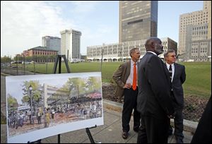 Toledo Mayor Mike Bell, center, Lowell Metzger, contracts manager for Rudolph/Libbe, Inc., left, and Dave Dysert, administrator of engineering services, right, talk about the Promenade Park Phase II construction project. An artist's rendering of the park stands to the left.