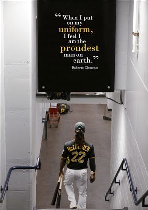 Pittsburgh Pirates' Andrew McCutchen (22) walks to the field before the National League wild-card playoff baseball game.