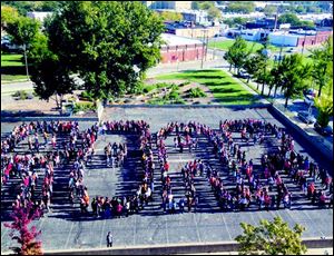 Toledo School for the Arts students spell out ‘Roar.’