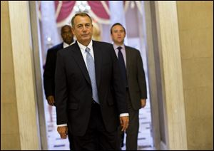 House Speaker John Boehner of Ohio walks to his office on Capitol Hill in Washington, Wednesday. The Republican-run House has rejected an effort by Democrats to force a quick end to the partial government shutdown.