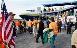 Members of Honor Flight Northwest Ohio board a flight to Washington D.C. on a previous trip.