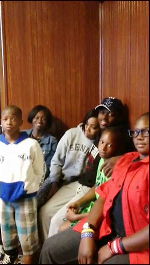 Among Toledo youths at a meeting at the Soul City boxing gym are, from left, Daveon Foster, 12; Alexis Smith, 17; Rhonda Paris, 19; Major Smith, 18; Caleb Jones 10; and Trevonn Smith, 14.