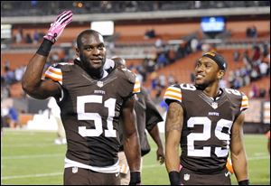 Cleveland Browns outside linebacker Barkevious Mingo (51) and cornerback Leon McFadden (29) celebrate after a 37-24 win over the Buffalo Bills Thursday.