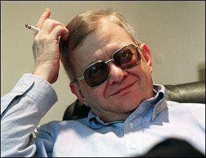 Writer Tom Clancy, shown in 1998, has his name on dozens of books and numerous video games.