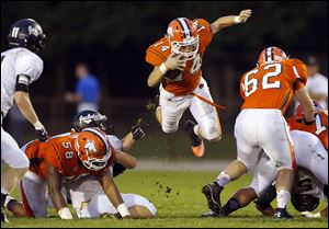 Southview's Samuel Stout is tripped up by Perrysburg's JP Newton during Friday night's game.