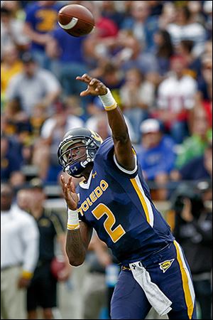 Toledo's Terrance Owens unleashes a pass at the Glass Bowl. The senior was 11 of 25 for 149 yards and a touchdown.