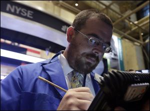 Trader Richard Scardino works on the floor of the New York Stock Exchange.