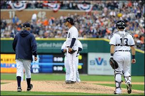 Detroit Tigers starting pitcher Anibal Sanchez stands on the mound as manager Jim Leyland walks up to replace him during the fifth inning today in Detroit.