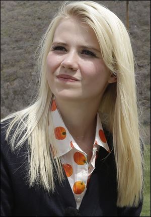 Elizabeth Smart talks with a reporter before an interview in Park City, Utah in May.