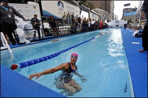 Long-distance swimmer Diana Nyad, who recently completed a record-breaking swim from Cuba to Florida, completes a lap during a continuous 48-hour marathon swim event in New York's Herald Square called 