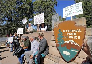 Protesters against the government shutdown gather at the Grand Canyon National Park entrance, which remained closed to visitors because of the partial government shutdown. 