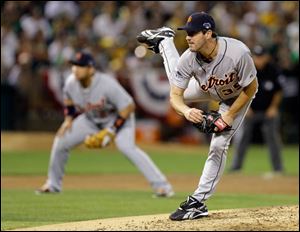 Detroit Tigers pitcher Justin Verlander (35) follows through in the third inning of Game 2 of an American League baseball division series against the Oakland Athletics.