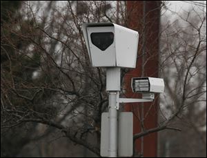 A Red-Light camera on the southbound corner of Talmadge Road at Sylvania Avenue in Toledo.
