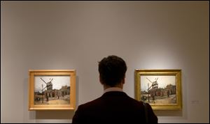 A visitor looks at Vincent van Gogh's 