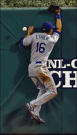 The Dodgers’ Andre Ethier can’t come up with a double by the Cardinals’ Carlos Beltran.