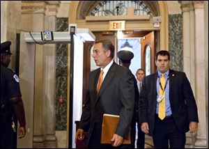 Speaker of the House John Boehner, R-Ohio, arrives at the Capitol to meet with fellow Republicans at an early closed-door caucus today in Washington.