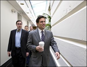 House Majority Leader Eric Cantor, R-Va., arrives to join Speaker of the House John Boehner, R-Ohio, and fellow Republicans for an early closed-door meeting today in the basement of the Capitol in Washington.