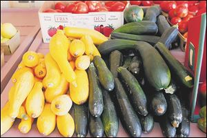 David Johnson's home grown zucchini and yellow squash on sale at the market.