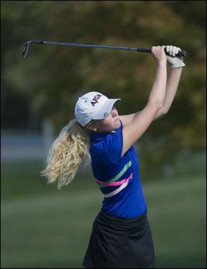 Makayla Dull of Lakota watches her shot on the 18th hole  during the Division II tournament.