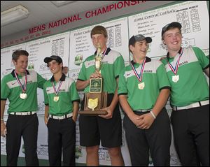 Ottawa Hills accepts their Division III championship trophy. From left is Ben Silverman, Michael Denner, R.J. Coil, with trophy, Matt Abendroth, and Ben Dayton.