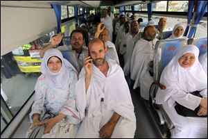 Egyptian pilgrims chant as they ride a bus from Mecca to Arafat, in the Muslim holy city of Mecca on Sunday. The hajj, a central pillar of Islam and one that able-bodied Muslims must make once in their lives, is a four-day spiritual cleansing based on centuries of interpretation of the traditions of Prophet Mohammad.