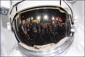 The 'Gravity' premiere red carpet as seen from a reflection in an astronaut's helmet at the AMC Lincoln Square Theaters in New York. The Warner Bros. astronaut adventure directed by Alfonso Cuaron and starring Sandra Bullock and George Clooney landed in the top spot at the box office for the second weekend in a row, according to studio estimates Sunday.
