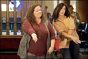 Detective Shannon Mullins (Melissa McCarthy, left) and FBI Special Agent Sarah Ashburn (Sandra Bullock) bust some moves during a night out on the town.