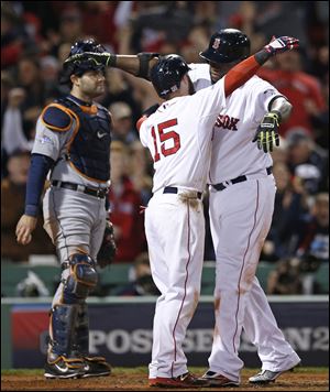 Boston's David Ortiz, right, celebrates his grand slam home run with teamate Dustin Pedroia.