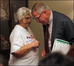 Julianne Emerson speaks to mayoral candidate D. Michael Collins.