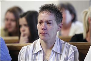 Michelle Grothause, mother of the victims, listens as Michael Fay pleads guilty to the murders of  her sons Blake and Blaine Romes.