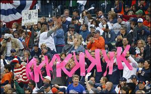 Fans hold up K signs after the Tigers’ Justin Verlander strikes out Jarrod Saltalamacchia in the fifth inning. Verlander struck out 10 batters in Game 3 and allowed only one run, but took the loss.