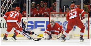 Columbus Blue Jackets right winger Cam Atkinson, second from left, scores a second period power play goal on Detroit Red Wings goalie Jonas Gustavsson, who had 36 saves in the contest.