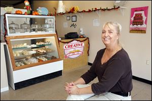 Kathy Nagypaul in her shop, Creative Cupcakes is among the business owners promoting the Secor Open Road Party in the Westgate area to celebrate the end of  the thoroughfare's reconstruction.