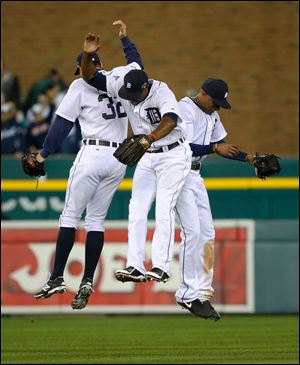 Detroit Tigers' Don Kelly, Torii Hunter, middle, and Austin Jackson celebrate after Game 4.