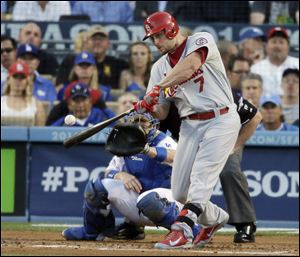 St. Louis Cardinals' Matt Holliday hits a two-run home run during the third inning.