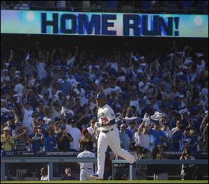 Los Angeles Dodgers' A.J. Ellis hits a home run during the seventh inning.