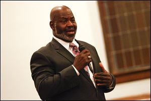Incumbent Mayor Mike Bell speaks during a mayoral candidate forum October 17, 2013 at the South Toledo Community Center on Broadway Street.