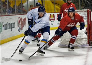 Forward Scott Arnold, left, is one of the several newcomers to the fifth season of play for the Walleye. Toledo begins with two road games to start the season.